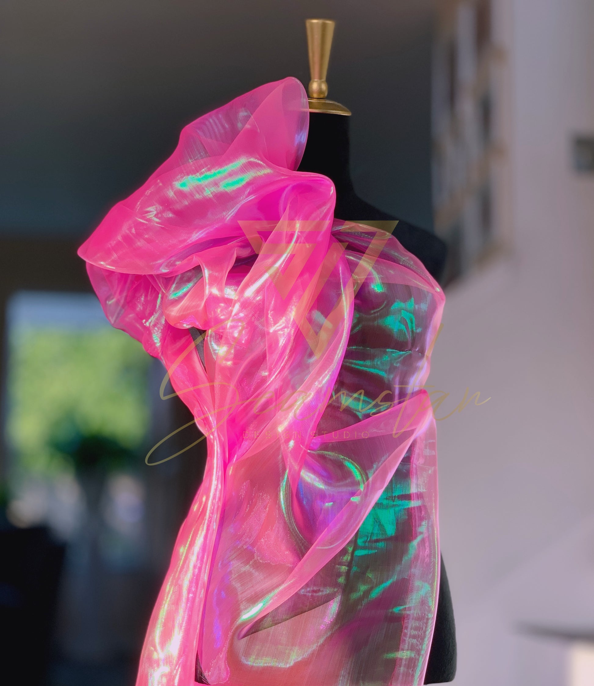 Bring vibrant energy and a touch of glamour to your next creative project with this eye-catching iridescent Organza fabric. Make a striking impression by creating dazzling garments, statement decorations, or unique craft items.