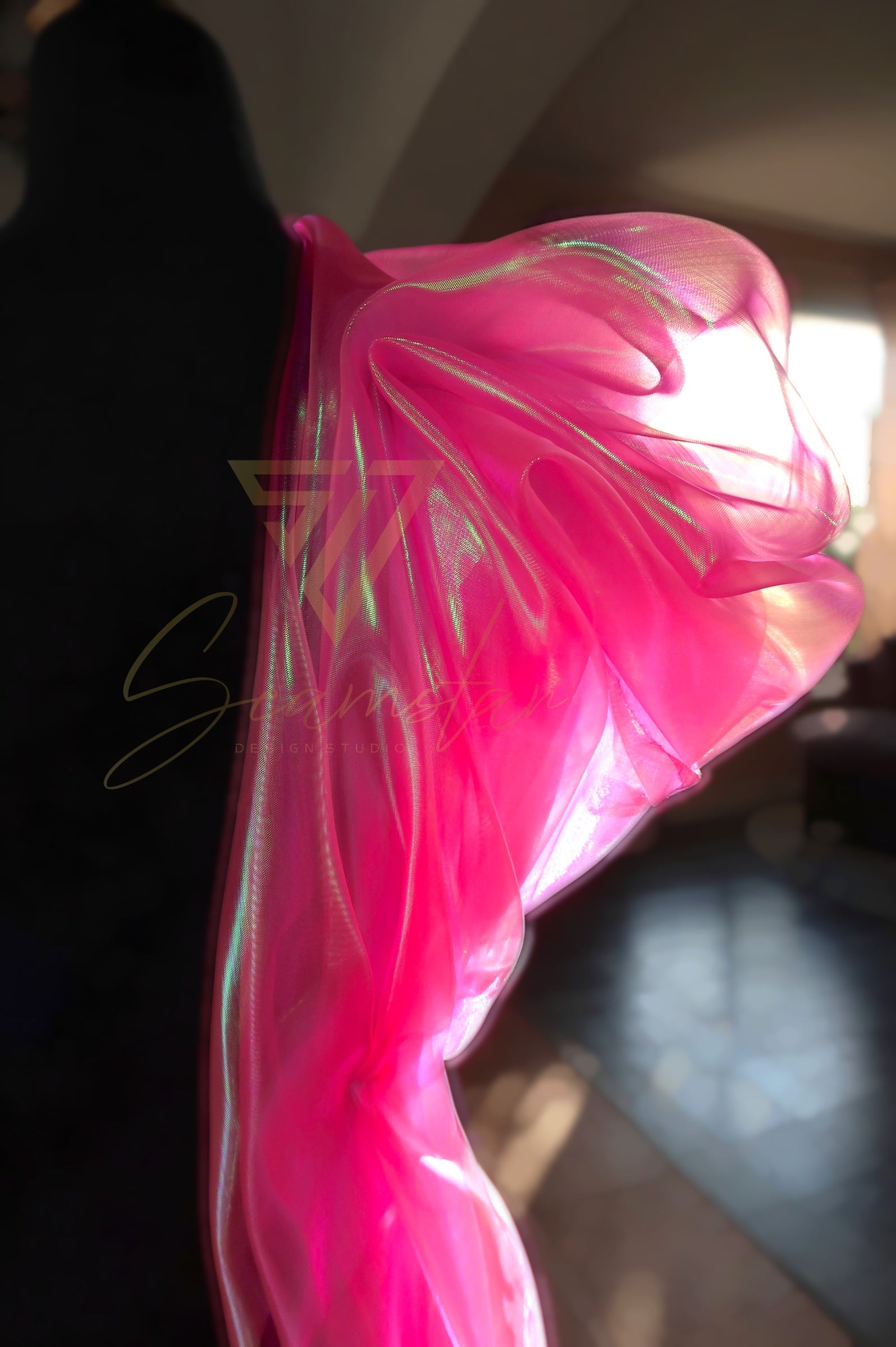 Bring vibrant energy and a touch of glamour to your next creative project with this eye-catching iridescent Organza fabric. Make a striking impression by creating dazzling garments, statement decorations, or unique craft items.