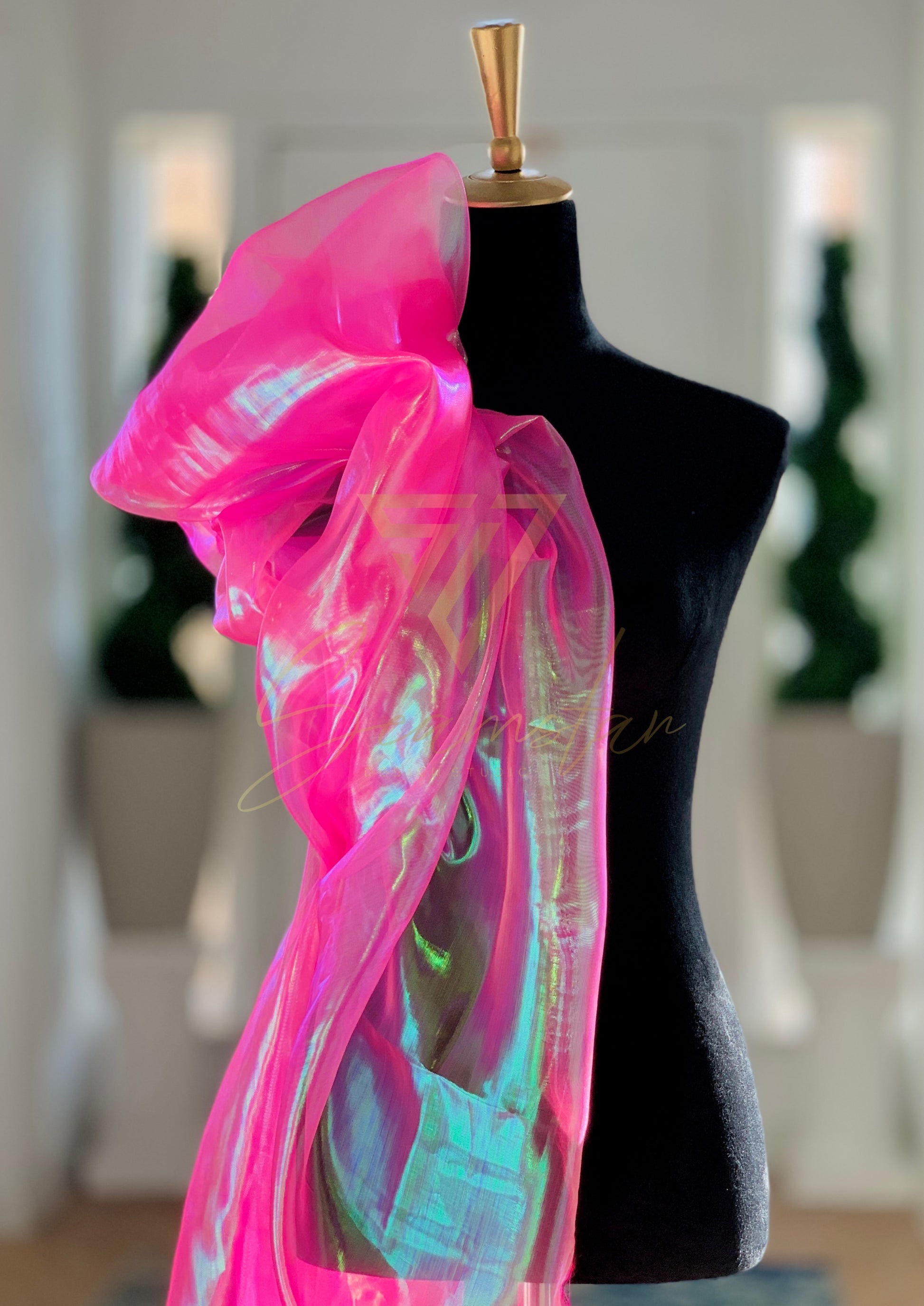 Bring vibrant energy and a touch of glamour to your next creative project with this eye-catching iridescent Organza fabric. Make a striking impression by creating dazzling garments, statement decorations, or unique craft items.